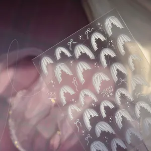 Close-up of MS 784 Japanese nail stickers featuring white lace veil and bow designs