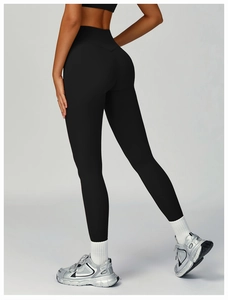 Rear view of high-waisted black yoga leggings showing butt-lifting shape and elastic fit