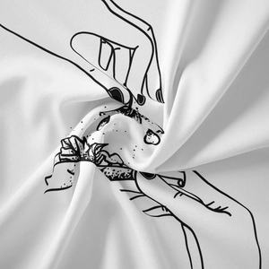 Detail of high-quality white fabric featuring minimalist hand-drawn line art tapestry