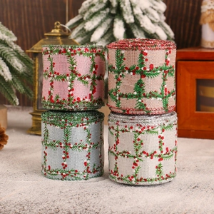 Christmas plaid ribbon set with pine needle patterns displayed on festive artificial snow