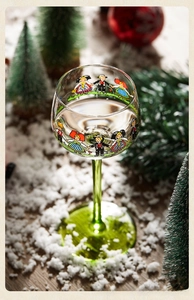 Detailed view of creative hand-painted folk art glass with festive holiday backdrop