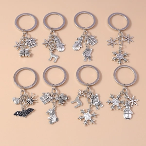 Set of 8 vintage silver alloy Christmas keychains with snowflake and reindeer charms