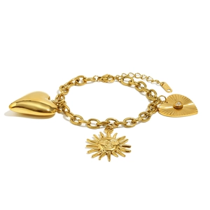 18K gold plated stainless steel chain bracelet with heart and sun pendants on white back