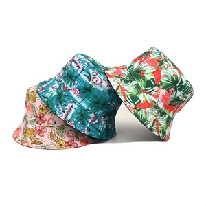 Flat top bucket hat with tropical flamingo and palm leaf print for sun protection