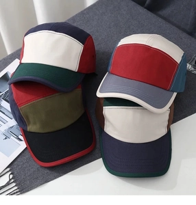 Detail of multi-color block five-panel camper caps with durable cotton twill fabric