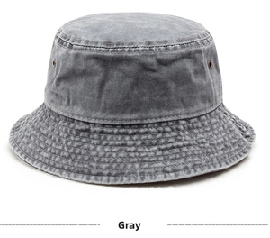 Detailed macro view of gray washed denim bucket hat with metal eyelets and reinforced stitching