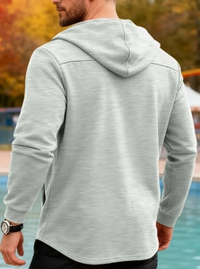 Rear view of a men's grey hooded jacket featuring a minimalist athletic fit and curved hem