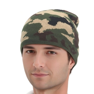 Detail of classic jungle camouflage knitted beanie with thick textured fabric for winter