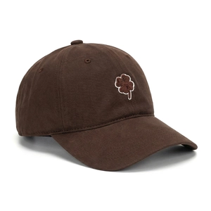 Detailed embroidery of a lucky clover on a dark brown cotton baseball cap