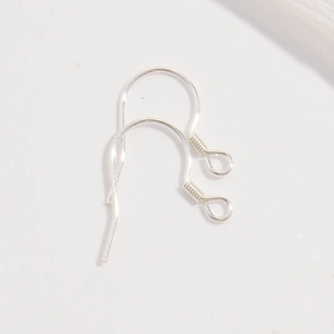 Detailed macro view of S925 sterling silver earring hooks for DIY jewelry making