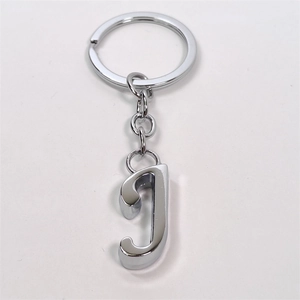 Detailed view of polished silver alloy metal keychain with a 3D letter J pendant