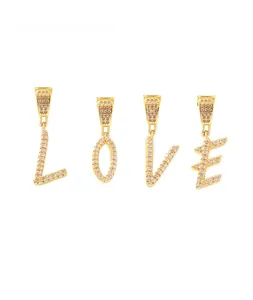 Macro detail of LOVE letter pendants with micro-pave cubic zirconia in 18k gold plating