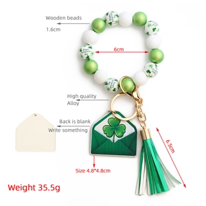 St. Patrick's Day wood bead keychain with green shamrock charm and tassel detailing