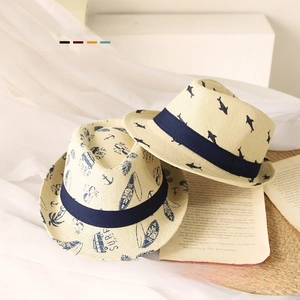 Detail view of woven straw sun hats with nautical shark and surf prints for kids