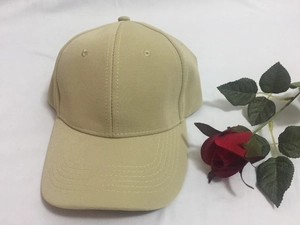 Classic beige wide-brim baseball cap with six-panel structure and curved visor peak