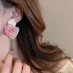 Elegant floral heart stud earrings with pink lace and crystal beads on a model