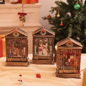 Detailed view of vintage Christmas music box lanterns with LED snow globe scenes