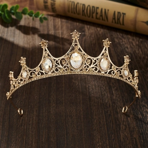 Detail of vintage gold crown headband with sparkling champagne and clear rhinestones