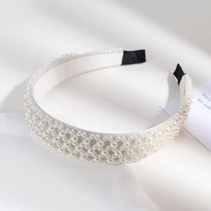 Baroque style pearl headband for women featuring dense white pearls with soft lighting