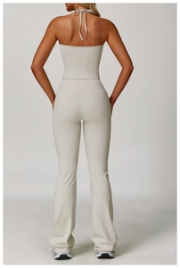 Back view of cream halter neck top and high-waisted flared yoga leggings set