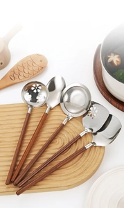 Detail of 304 stainless steel kitchen tool set with Japanese style walnut handles