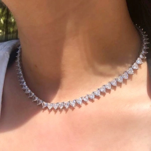 5mm heart-shaped zircon tennis chain necklace in silver finish worn by a model