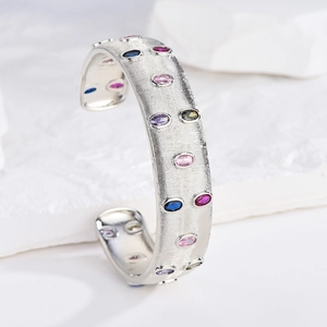 Italian style silver finish bangle with colorful oval gemstones and brushed metal texture