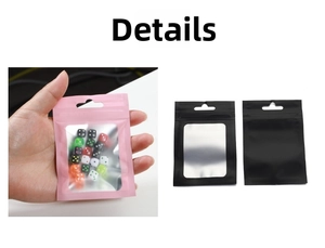 Close-up of matte aluminum zip lock bag with clear window showing colorful dice inside