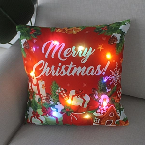Christmas LED light-up pillow with Merry Christmas print and colorful glowing effects