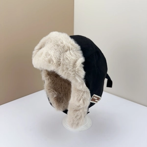 Winter bomber hat in black and beige faux fur with vintage MY 1982 label detail