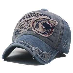 Distressed vintage cotton baseball cap featuring shark patch embroidery and washed finish