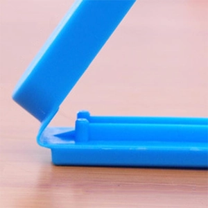 Macro shot of a blue 7cm plastic sealing clip for food storage and tea freshness