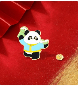 Macro detail of Chinese style panda enamel pin on festive red textured background
