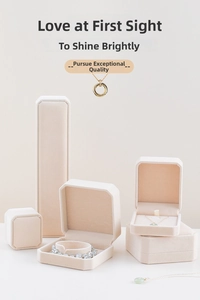 Detailed set of premium beige velvet jewelry boxes for rings, necklaces and bracelets