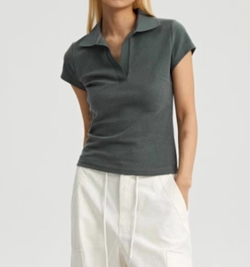 Detail of slim fit vintage polo shirt with V-neck collar and contrast stitching