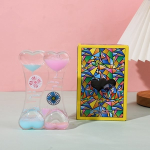 Detail of blue and pink heart liquid motion bubbler with geometric gift packaging