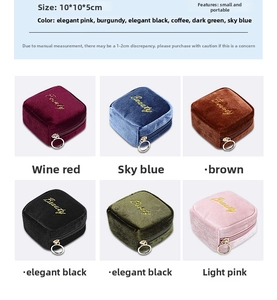 Macro view of compact velvet jewelry boxes in six colors with gold Beauty embroidery