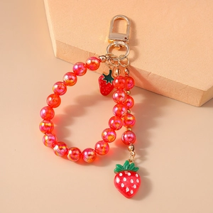 Fashionable strawberry beaded keychain with red resin beads and golden metal clasp for bags