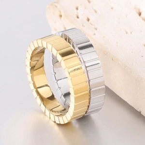 Detail of 4mm stainless steel ice cube rings in gold and silver finish with geometric pattern