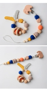 Detail view of wood and silicone pacifier clip with crochet beads and elephant engraving
