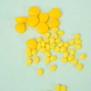 Bright yellow artificial corn kernels in two sizes for DIY crafts and food model decoration