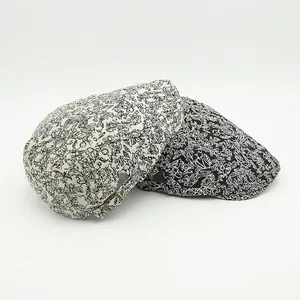 Vintage floral jacquard beret caps in black and white with bronze adjustable side buckles
