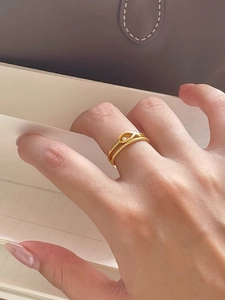 Stacked 925 sterling silver gold-plated rings with twisted texture and hollow accents