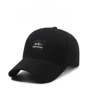 Close-up of durable black twill baseball cap featuring narason mountain logo embroidery