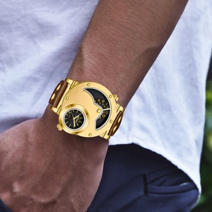 Men's gold dual-timezone quartz watch with brown leather strap and rivet details on wrist