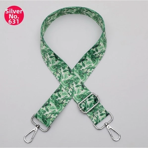 Adjustable bag strap with green floral webbing and polished silver metal hooks