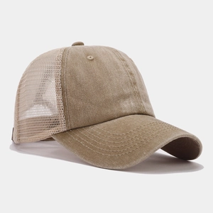 Detail of khaki truck cap showing breathable mesh panels and reinforced brim stitching