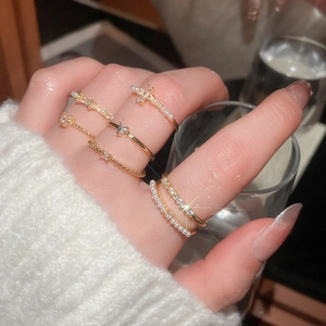 Detailed view of luxury ring set with pearls, zircon flowers and gold plating on hand