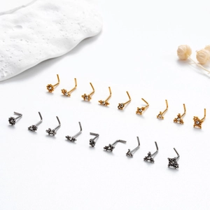L-shaped nose studs in gold and silver finish with crystal stones on white stones