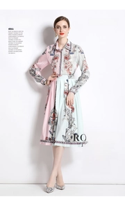Detailed view of women's long sleeve pleated dress featuring floral print and satin finish
